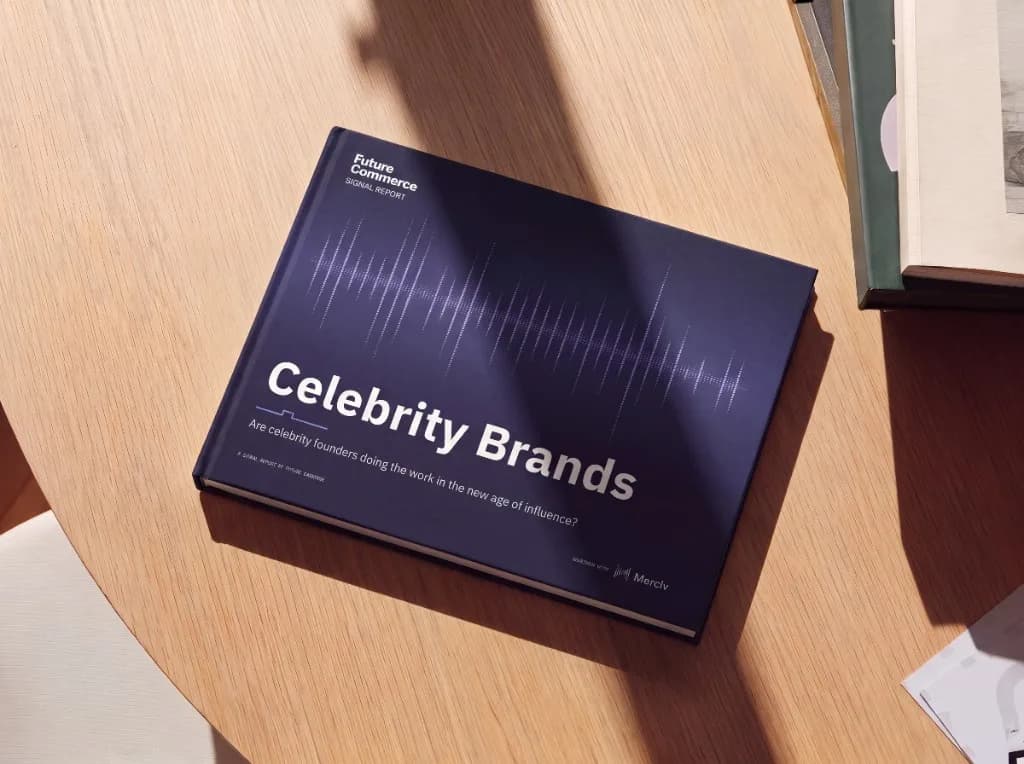 The Celebrity Brands Signal report, printed, on a wooden table