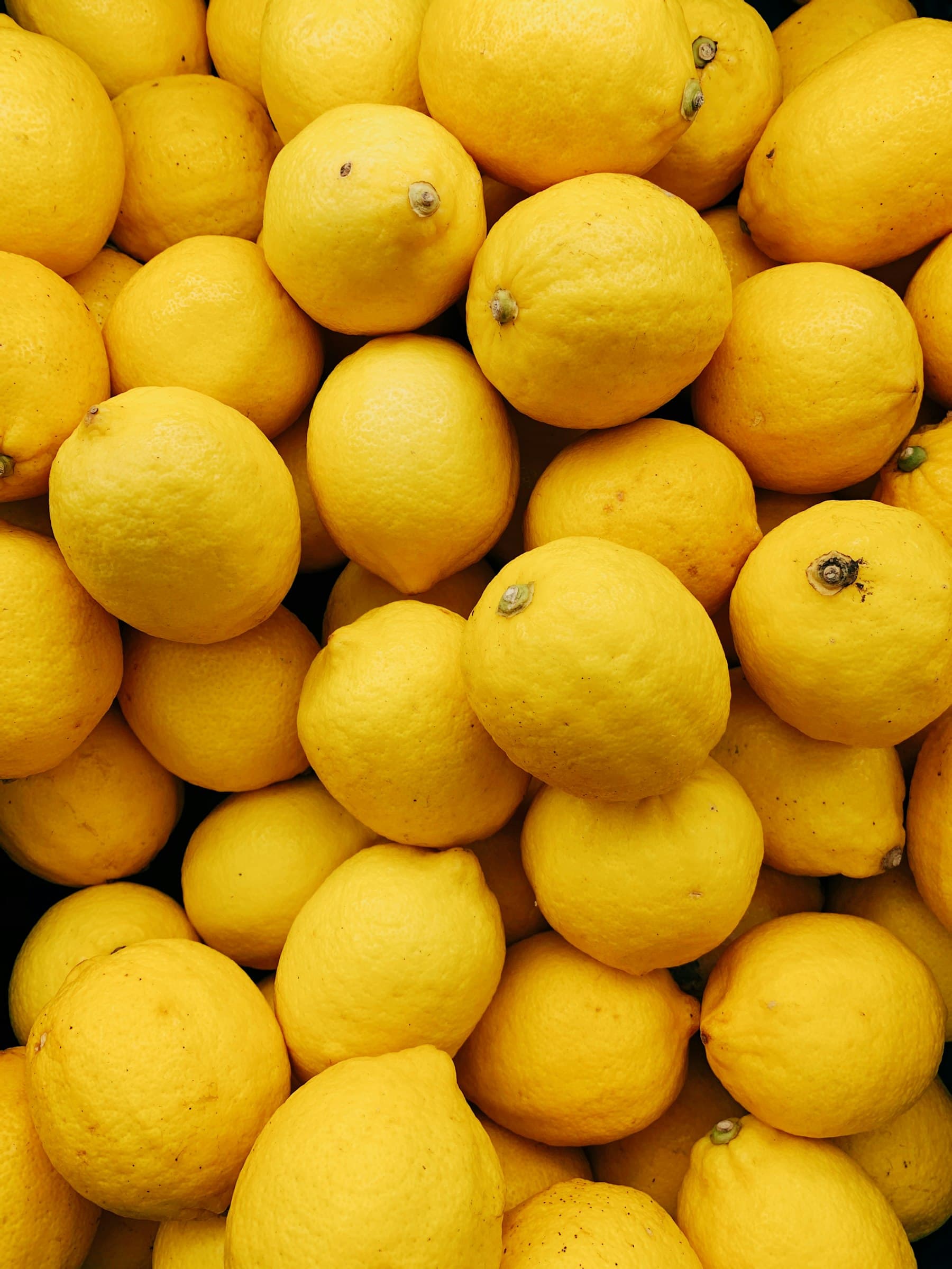 A full frame of bright yellow lemons
